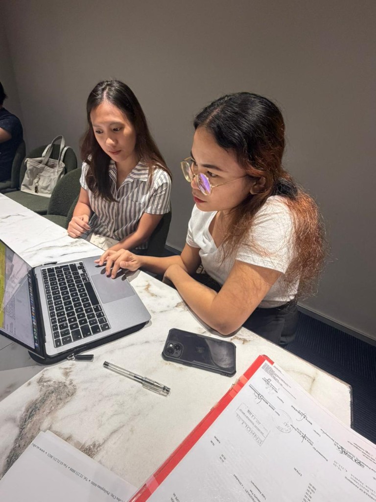 Interns reviewing enrollment and project documentation